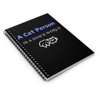 A Cat Person In A Dog's World Black Notebook angled view
