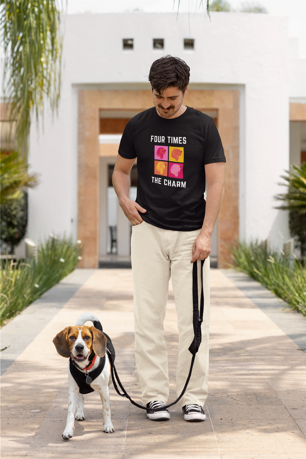 Man walking his beagle, wearing the Four Times The Charm tee